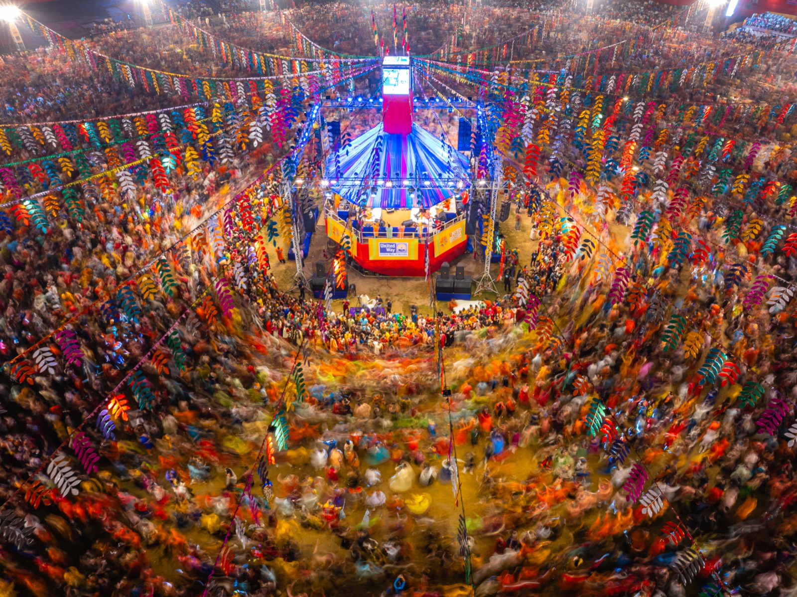 A vast Garba gathering fills a festival ground in Vadodara, Gujarat.