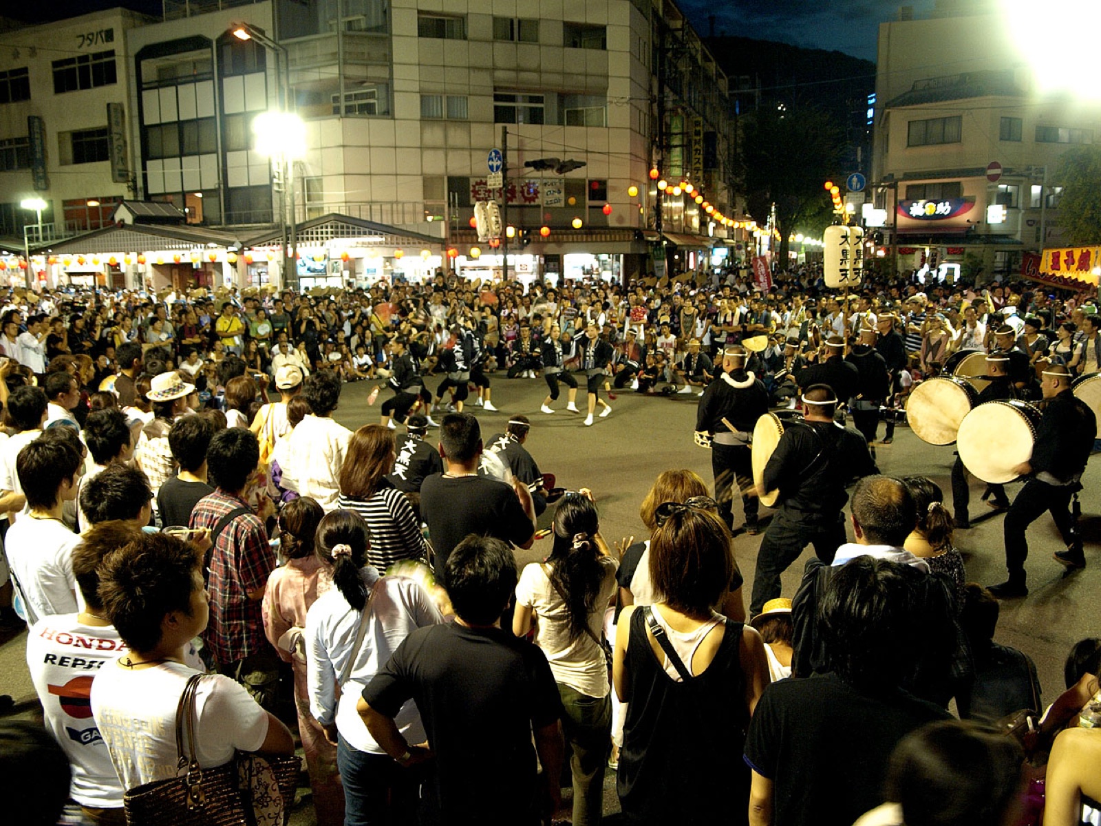 Musicians and dancers perform Awa Odori before a street audience in Tokushima.