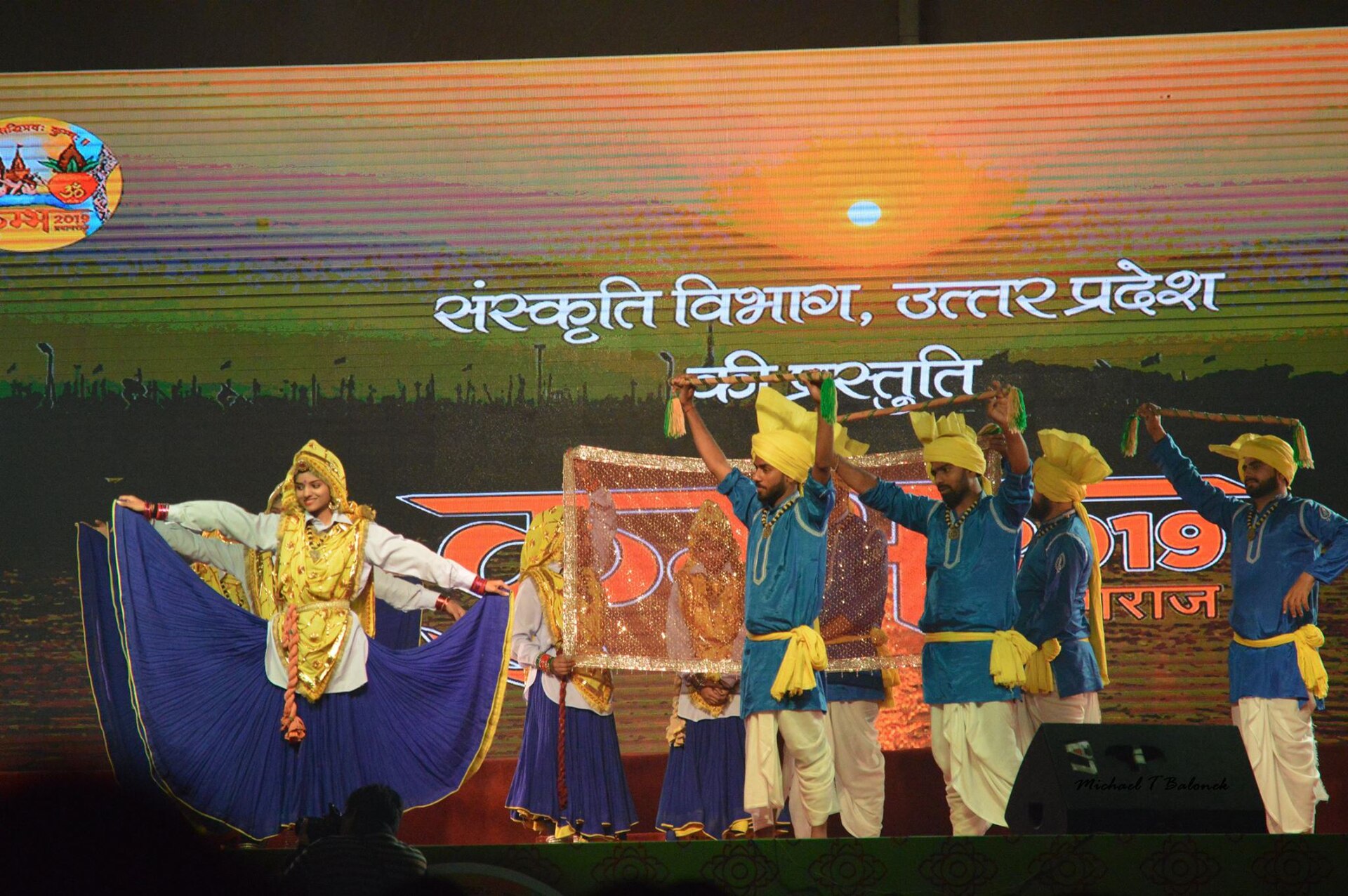 Dancers from Haryana performing on a stage at Kumbh Mela in 2019.