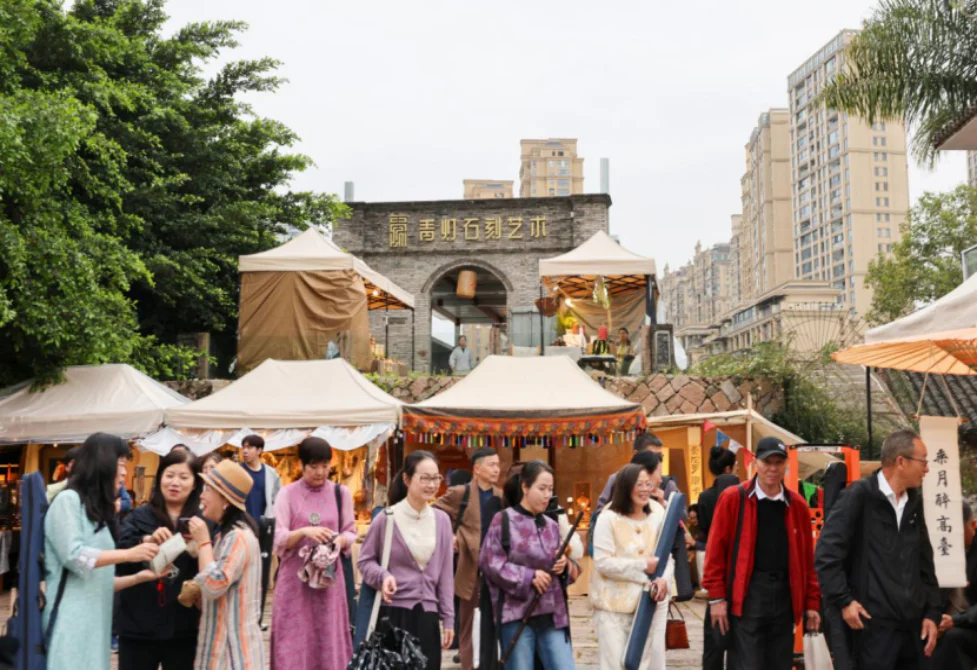 Visitors gather below the Qingdeng Stone Carving Art Museum entrance during the spring 2026 Qingdeng cultural market in Wenzhou